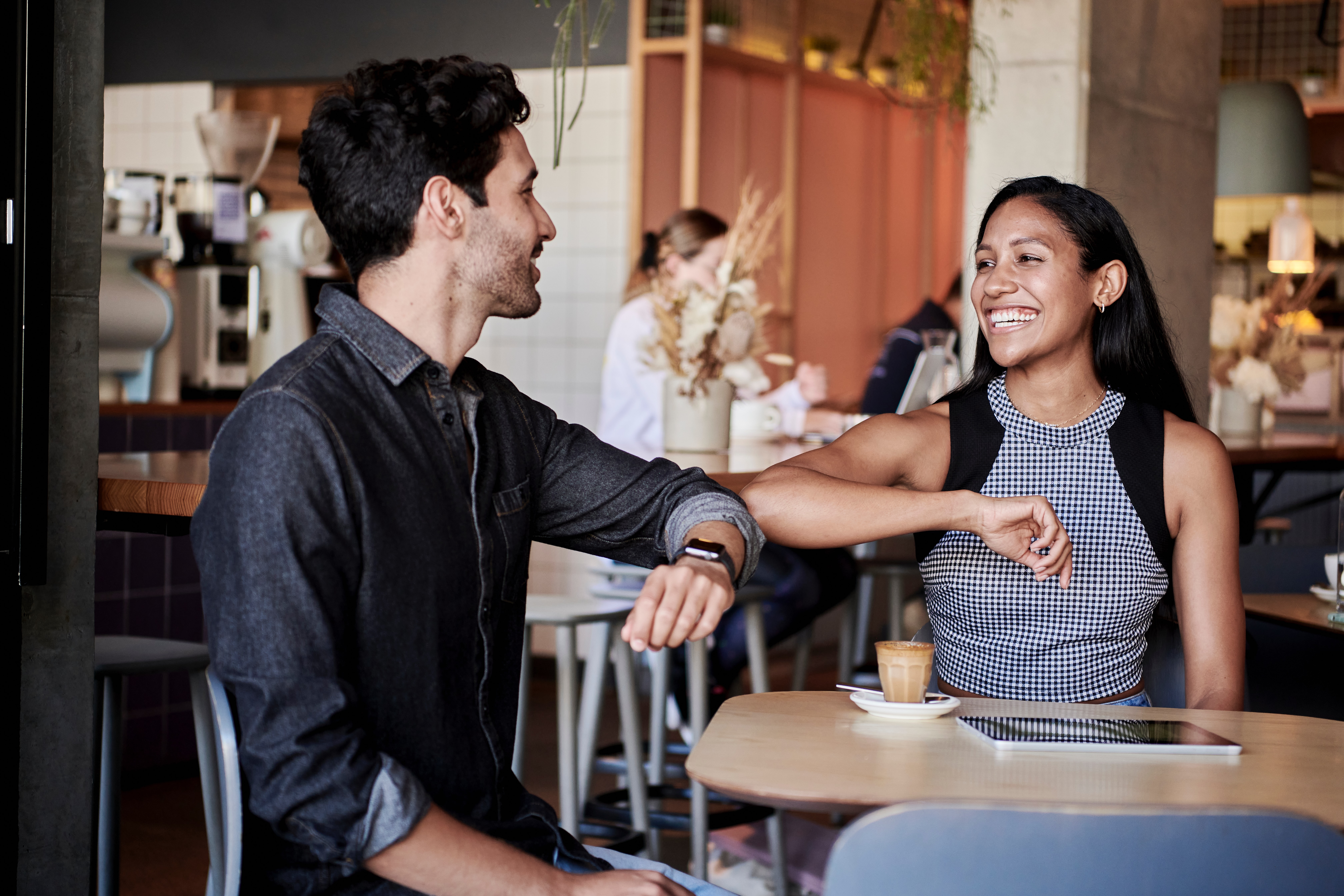 Two people are greeting