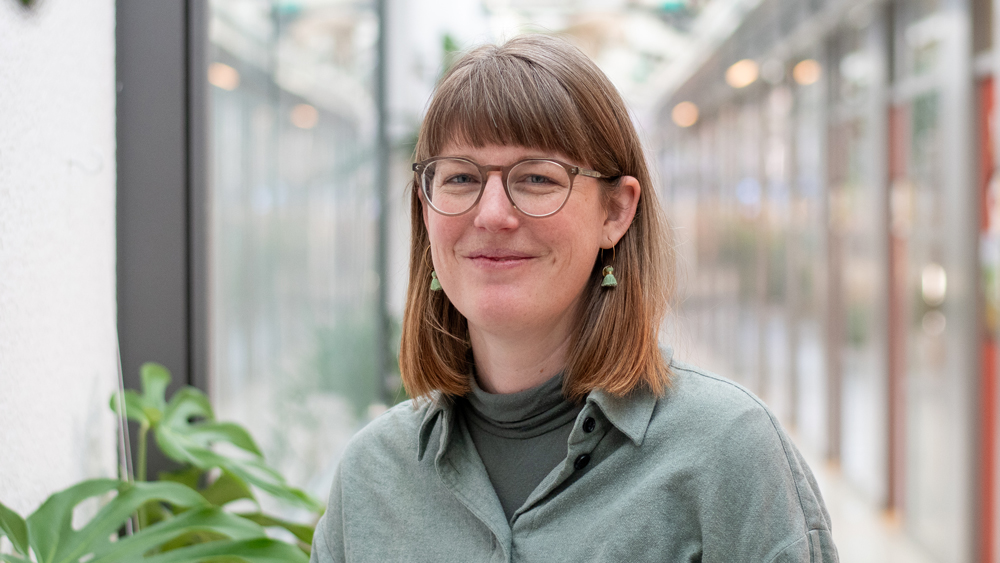 Portrait photo of a woman indoors.