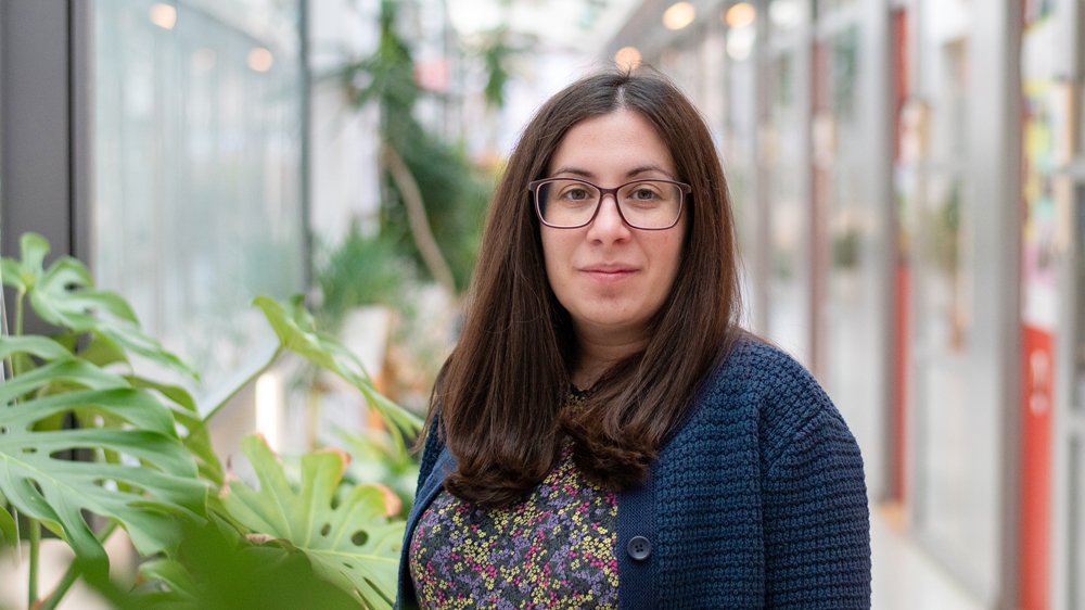 Portrait photo of a woman indoors.