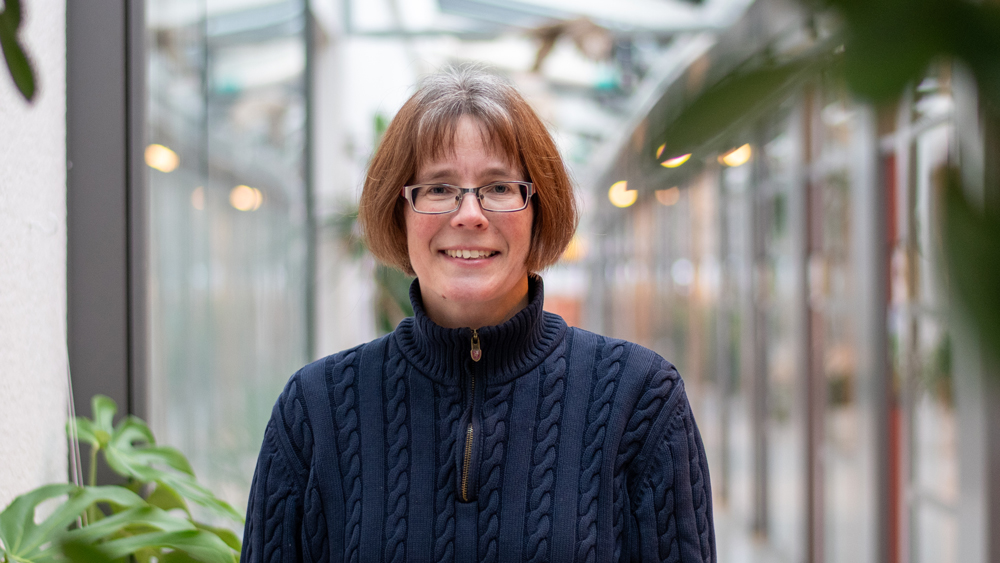Portrait photo of a woman indoors.