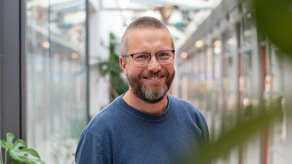 Portrait photo of a man indoors.