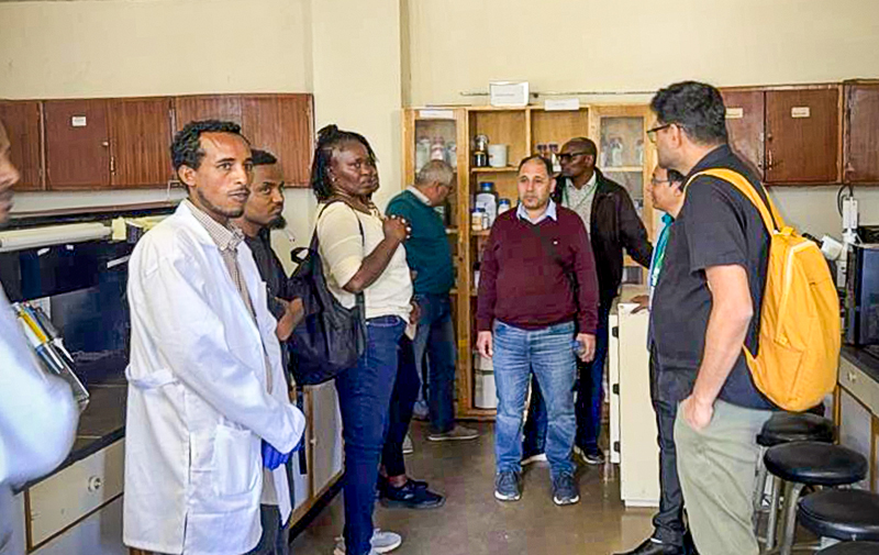 Several people in a lab. Photo.