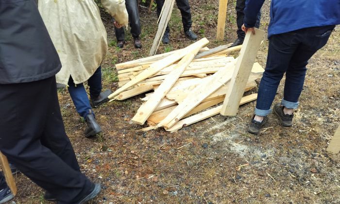 Wood boards on ground.
