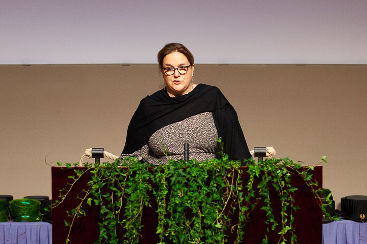 Picture of Stéphanie Robert standing at the parnassus giving her honorary lecture.